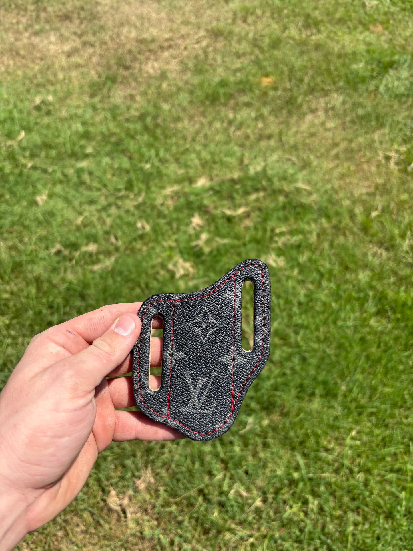 LV sheath with red stitching