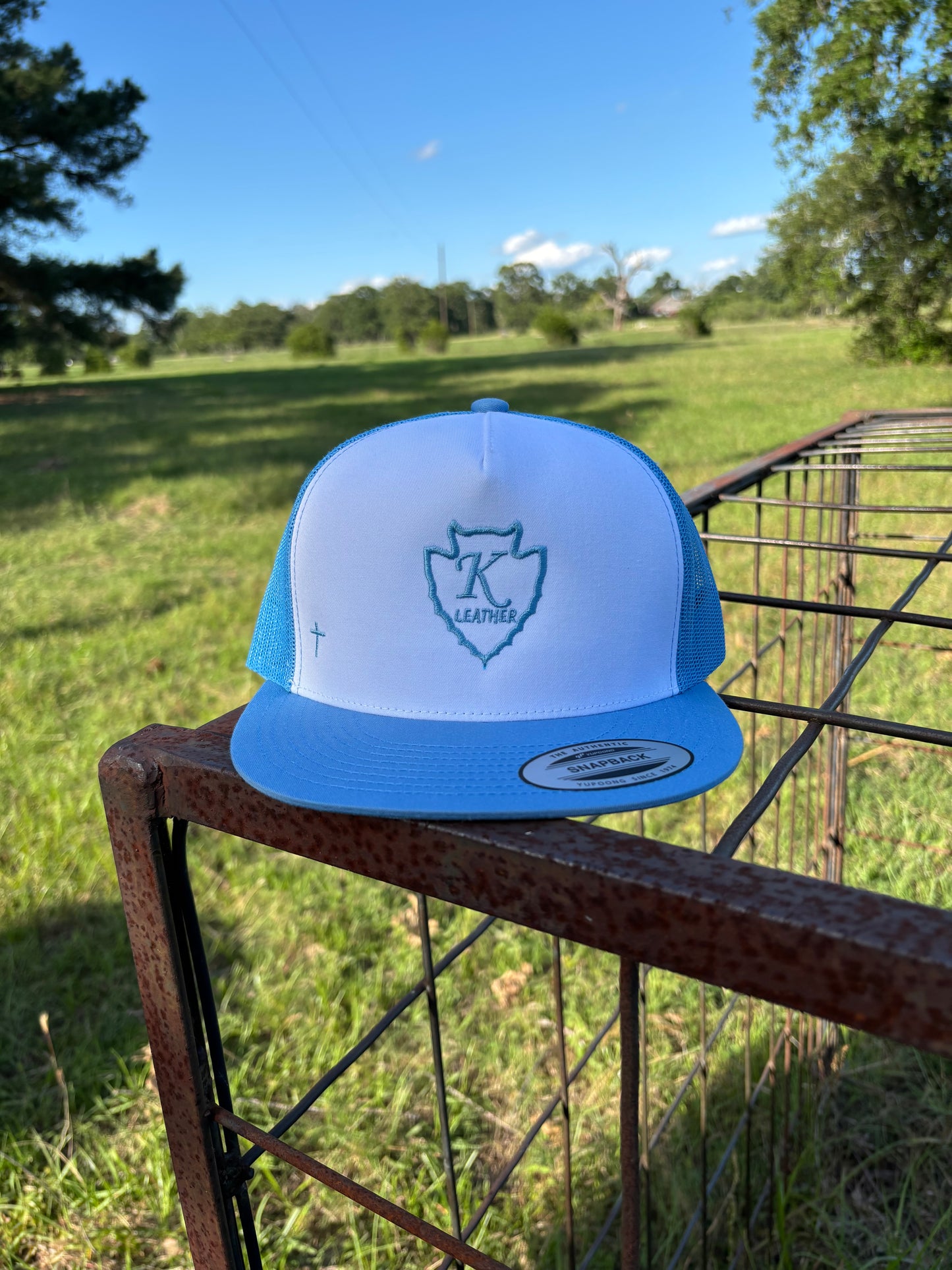 Light blue and white trucker